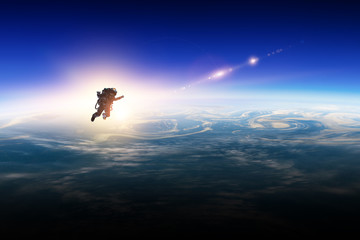 Wall Mural - astronaut in space on planet orbit.