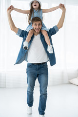 Wall Mural - Happy loving family. Father and his daughter child girl playing together. Father's day concept