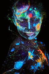 Wall Mural - uv painting of a universe on a female body portrait
