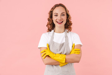 Wall Mural - Cheerful woman housewife in gloves.