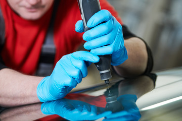 automobile windshield glass repair service. Car glass or chip crack repairing