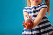© fotofabrika - Little girl with piggy bank moneybox  against blue background