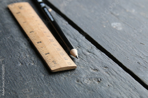 Fotomural wooden ruler lies on a vintage table