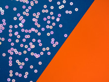 Pink Dot Circle Confetti On Blue Orange Background.