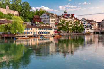 Fototapete - Cozy houses on Limmat river embankment at sunrise in Old Town of Zurich, the largest city in Switzerland