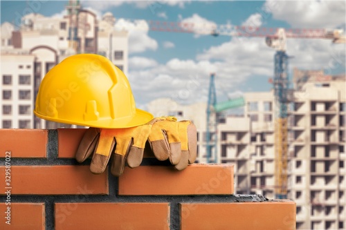 Masonry build with worker hard hat and glaves Tableau sur Toile