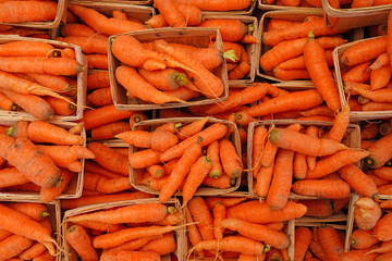 Wall Mural - Containers of Fresh orange carrots for sale at a farmers market