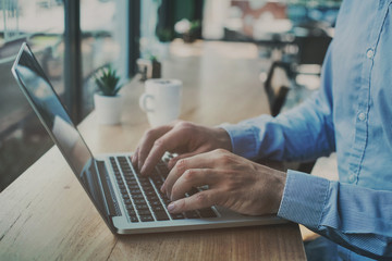 freelancer working on computer in cafe, freelance job online, reading email, banking online