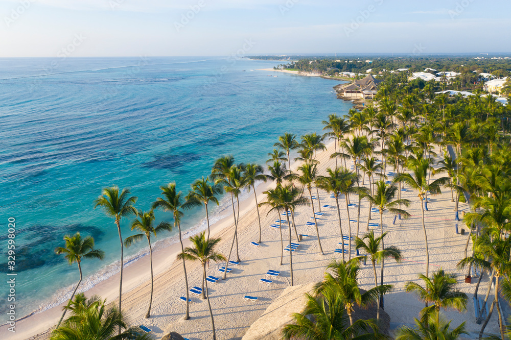 Aerial view of beautiful white sandy beach in Punta Cana, Dominican Republic - obrazy, fototapety, plakaty 