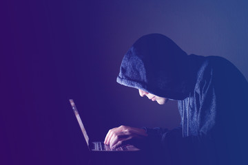 hacker with computer, cyber attack concept