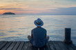 relaxation and tranquility, person looking at beautiful sunset landscape scene in summer evening
