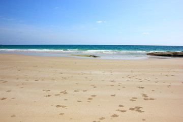 Beautiful white clouds on blue sky over calm sea with sunlight and clear sky.