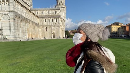 Canvas Print - Woman wearing health mask visiting Field of Miracles, Pisa