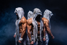Four Muscular Gothic Man Standing Shirtless On Black Background. Concept Of Power, Strength And Heroism 