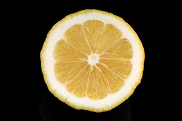 Canvas Print - Yellow lemon closeup cut black background