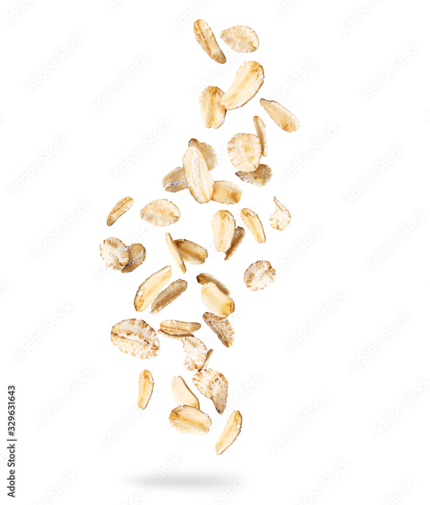 Oat flakes frozen in the air, isolated on white background - obrazy, fototapety, plakaty 