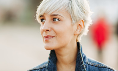 casual portrait of beautifu blond young woman outdoors