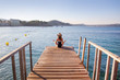 © yanlev - yoga woman on pier