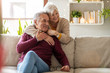 © pikselstock - Portrait of a happy senior couple relaxing together at home