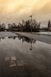 Frankfurt skyline reflection in a rain puddle
