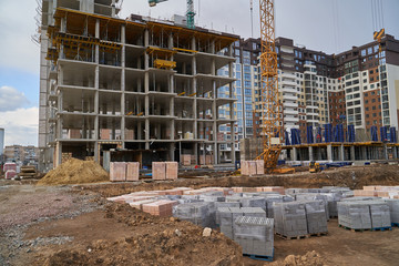 Construction site. High rise Building under construction. Construction of high-rise residential building