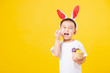 © sorapop - little children boy smile standing so happy bunny ears in Easter festival day holding easter eggs