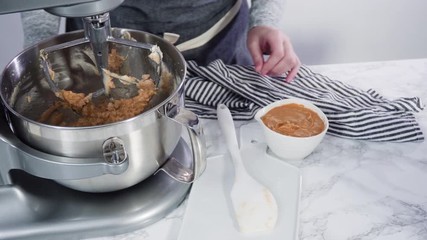 Canvas Print - Step by step. Mixing ingredients in standing electric mixer for baking peanut butter cookies.