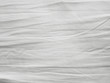 © Nattawut - Soft white wrinkled fabric background