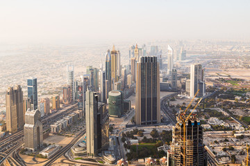 Wall Mural - Dubai, UAE - May 2015: View of high rise buildings during night sky from the observation deck of the world's Tallest building, Burj Khalifa