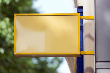 Wall Mural - Blank sign board on a shop wall