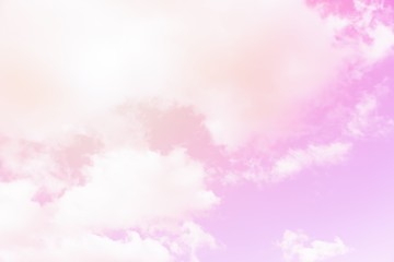 Wall Mural - Sunny pink sky background. Beautiful warm sky with clouds. Toned photo