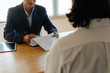 © Vittaya_25 - business HR manager reading resume with young man during job interview and explaining about his profile sitting in meeting room at office, human resources, business job interview, employment concept