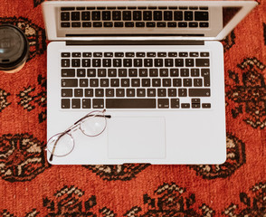 laptop on a carpet with  opticals 