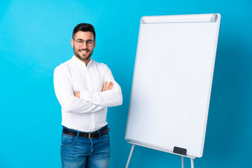 Sticker - Businessman giving a presentation on white board giving a presentation on white board and smiling