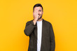 © luismolinero - Man over isolated yellow background covering a eye by hand