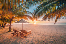 Beautiful Tropical Sunset Scenery, Two Sun Beds, Loungers, Umbrella Under Palm Tree. White Sand, Sea View With Horizon, Colorful Twilight Sky, Calmness And Relaxation. Inspirational Beach Resort Hotel