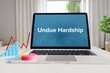 Undue Hardship – Statistics/Business. Laptop in the office with term on the Screen. Finance/Economy.