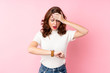 © luismolinero - Young Russian woman over isolated pink background with wrist watch and surprised