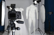 © New Africa - Taking pictures of ghost mannequins with modern clothes in professional photo studio, focus on camera