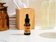 Leinwandbild Motiv CBD oil in a neutral bathroom setting. CBD oil concentrate derived from cannabis and used for wellness, stress relieve, and healing. 