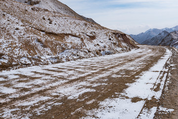 Wall Mural - the gravel road on the snow mountain