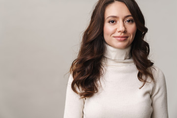 Photo of caucasian happy woman with long brown hair smiling at camera