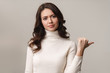 © Drobot Dean - Photo of caucasian woman frowning and gesturing at copyspace