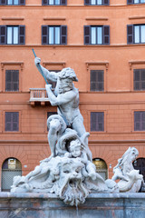 Wall Mural - The Fontana del Nettuno, also called the Fontana dei Calderari, is the fountain located in Piazza Navona, Rome, Italy. Neptune battles an Antonio della Bitta octopus in white Carrara marble.