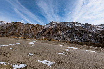 Wall Mural - the gravel road on the snow mountain