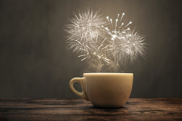 A cup with fireworks over it