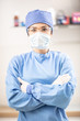 Portrait of female doctor in special surgical sterile protective clothing