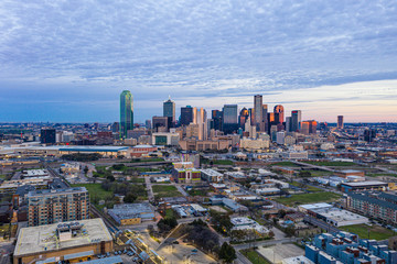 Panoramic picture of the Dallas skyline in morning sun and cloudy sky