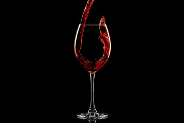 Red wine splash over dark background