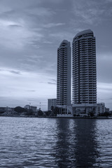 Canvas Print - Skyscrapers along the river in Thailand.